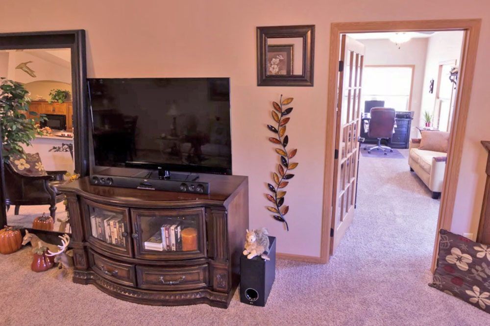 Townhome villa interior looking into the four season sunroom at Primrose Retirement in Aberdeen, SD