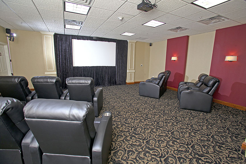 Relax in luxurious recliners while you watch a show in our Movie Theater