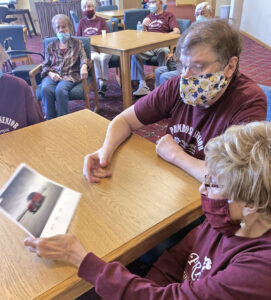 Primrose residents view pamphlets at a lifelong learning session.