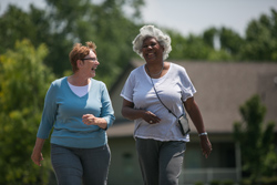 Two active seniors taking a walk; how to prevent falls