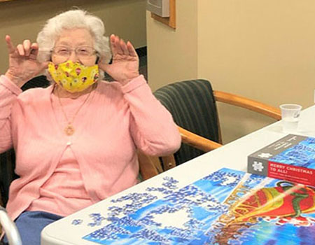 Senior woman putting together a puzzle