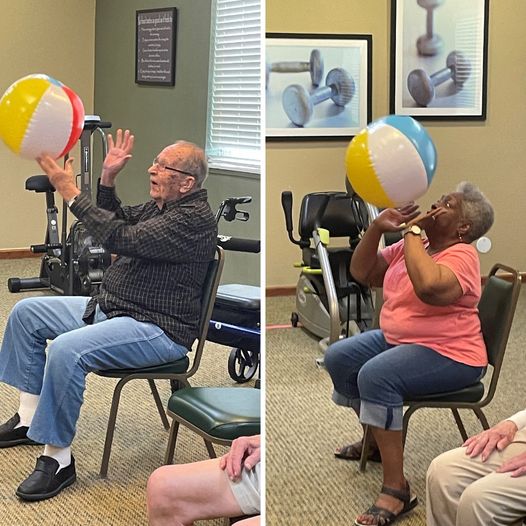 A man and woman at Primrose playing balloon volleyball.