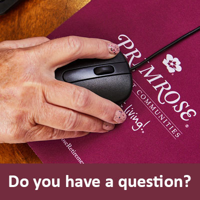 Person using computer mouse to find answers online with a caption of 'Do you have a question?' and links to https://primroseretirement.com/company/contact-primrose-retirement/