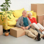 senior couple packing to move