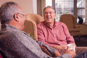 Two senior men catching up during a chat