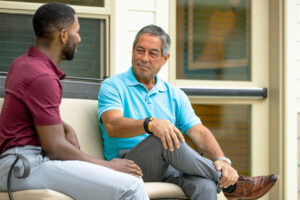 Staff member talks with male resident family member