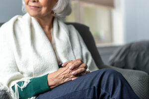 Senior woman looking out the window in a reflective moment