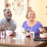 Assisted senior living residents dining together