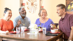 Assisted senior living residents dining together