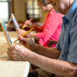 Memory care residents participating in art therapy